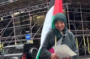 Zohar in Glasgow with a Palestinian flag.